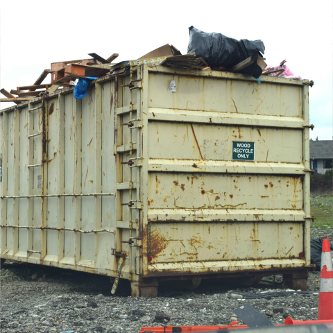 Large roll-off dumpster filled with construction debris, representing reliable Dumpster Rental in Mason County, MI for home renovations, construction projects, cleanouts, and waste disposal.