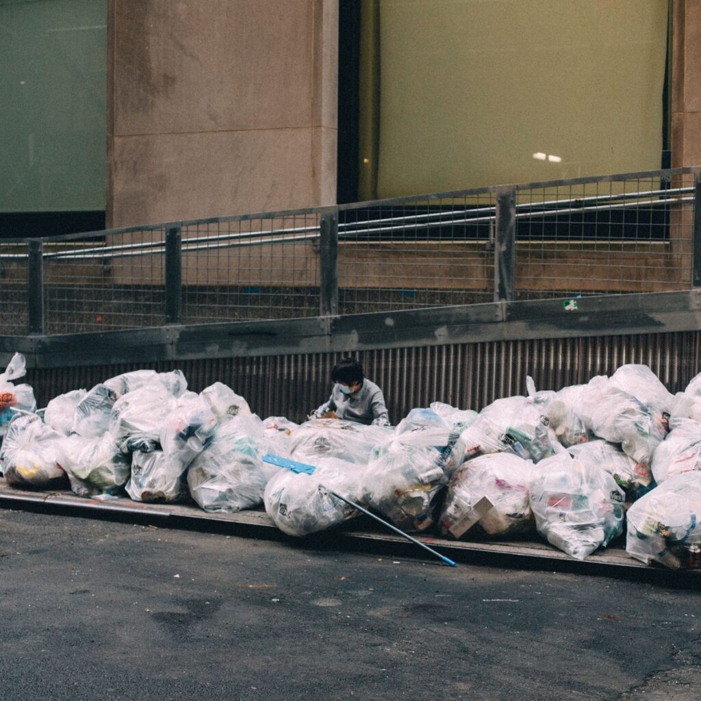 Bags of collected waste prepared for dumpster disposal in Pentwater, MI