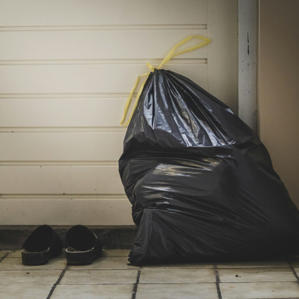 Bag of household waste prepared for dumpster disposal near me
